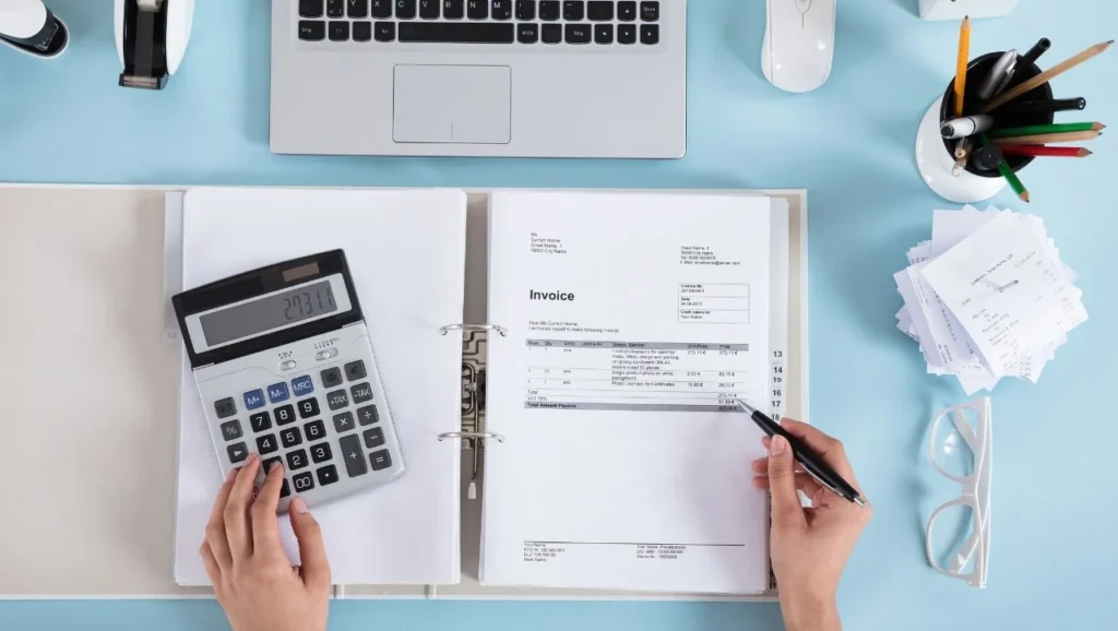 Desk with billing statement and calculator